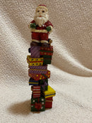 Santa Sitting on Presents Figurine