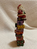 Santa Sitting on Presents Figurine